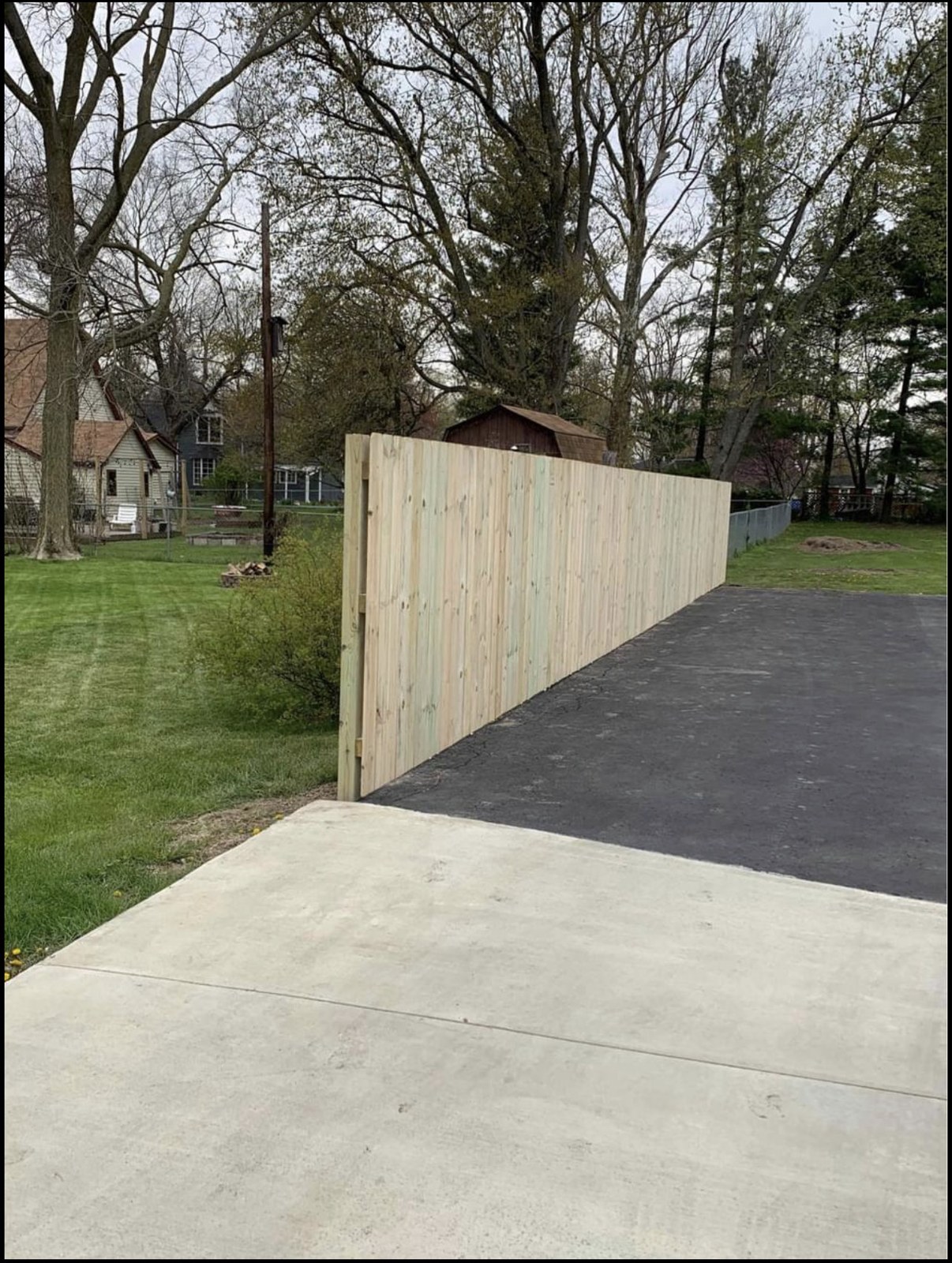 Wood privacy fence installed by Twiins Custom Construction